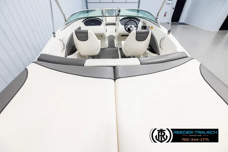 Slide: The Image of 2011 Sea Ray 185 Sport boat interior with dual seats and steering wheel. - 13