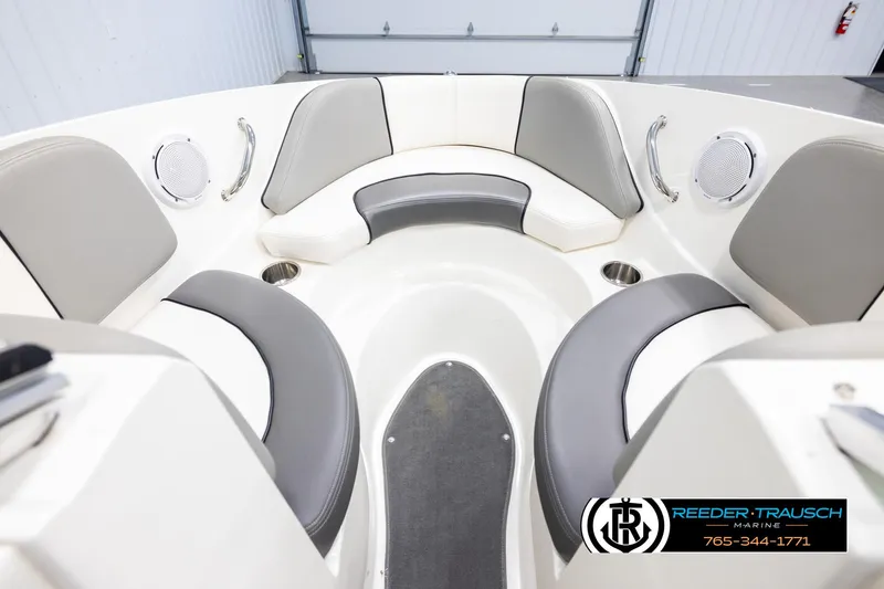 Slide: The Image of 2011 Sea Ray 185 Sport boat interior with gray and white seating, cup holders, and speakers. - 15