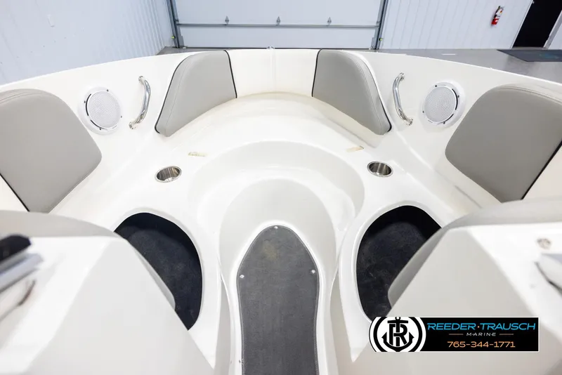 Slide: The Image of 2011 Sea Ray 185 Sport boat interior with seating and cup holders. - 16