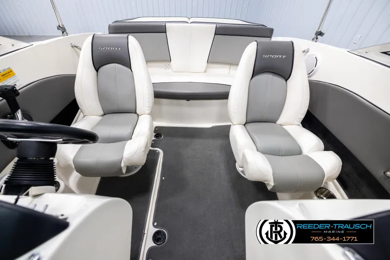 Slide: The Image of Interior of 2011 Sea Ray 185 Sport boat with gray and white seating. - 18