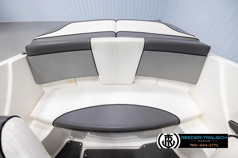 Slide: The Image of 2011 Sea Ray 185 Sport boat interior with gray and white seating. - 19