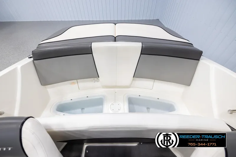 Slide: The Image of 2011 Sea Ray 185 Sport boat interior with gray and white seating. - 20