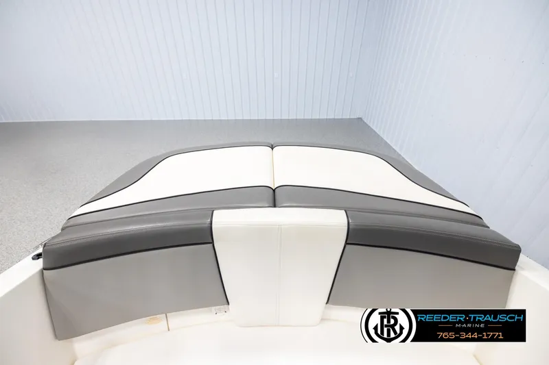 Slide: The Image of 2011 Sea Ray 185 Sport boat interior with gray and white seating. - 21