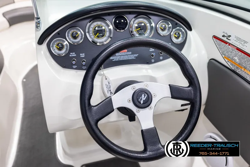 Slide: The Image of Steering wheel and dashboard of 2011 Sea Ray 185 Sport boat. - 26