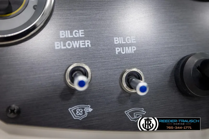 Slide: The Image of Control panel of 2011 Sea Ray 185 Sport with bilge blower and pump switches. - 28