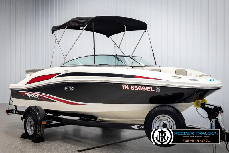 Slide: The Image of 2011 Sea Ray 185 Sport boat with black and red accents on a trailer. - 3