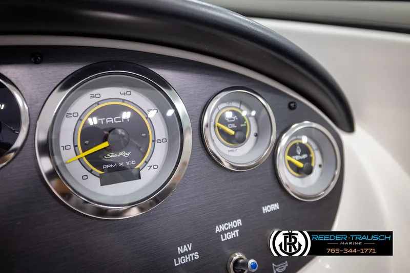 Slide: The Image of Dashboard of a 2011 Sea Ray 185 Sport boat with gauges and controls. - 30