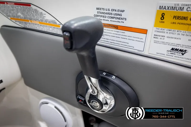 Slide: The Image of Throttle control of a 2011 Sea Ray 185 Sport boat with safety warnings. - 33