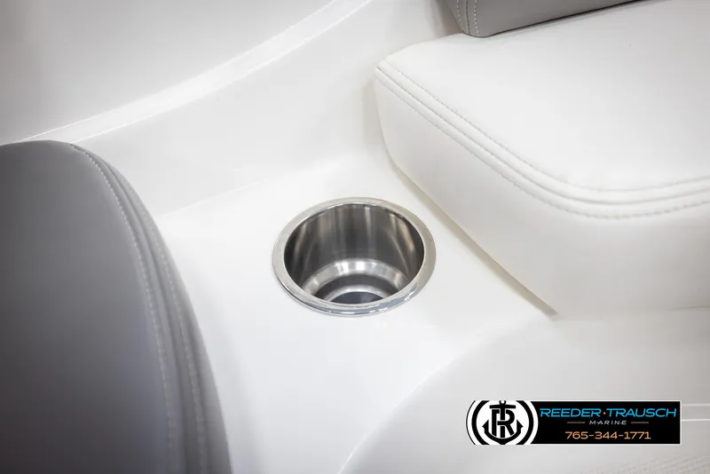 Slide: The Image of 2011 Sea Ray 185 Sport boat interior with cup holder and seating detail. - 35