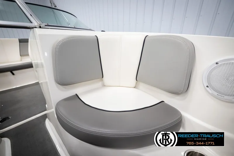 Slide: The Image of 2011 Sea Ray 185 Sport boat interior with gray cushioned seating and speaker. - 40