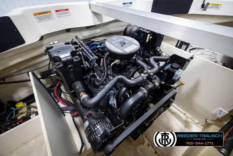 Slide: The Image of Engine compartment of a 2011 Sea Ray 185 Sport boat, showcasing detailed mechanical components. - 41