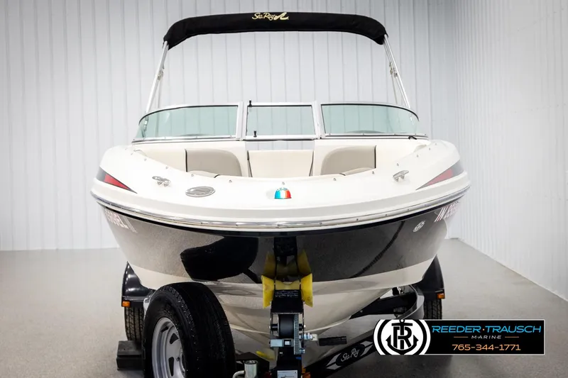 Slide: The Image of 2011 Sea Ray 185 Sport boat on trailer in showroom. - 8
