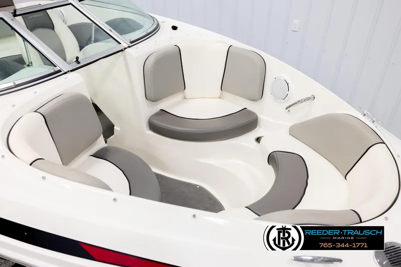 Slide: The Image of 2011 Sea Ray 185 Sport boat interior with gray and white seating. - 9