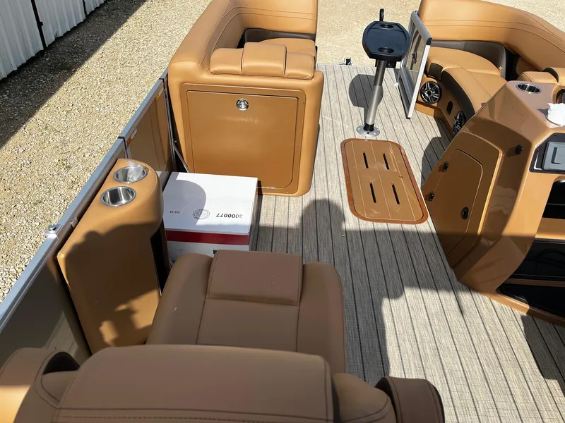 Slide: The Image of Luxurious 2025 SunCatcher Fusion 324SL boat interior with tan seating and modern amenities. - 11
