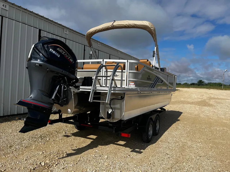 Slide: The Image of 2025 SunCatcher Fusion 324SL pontoon boat with Yamaha outboard motor on trailer. - 7