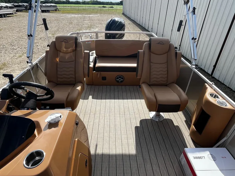 Slide: The Image of 2025 SunCatcher Fusion 324SL boat interior with tan seating and modern design. - 8