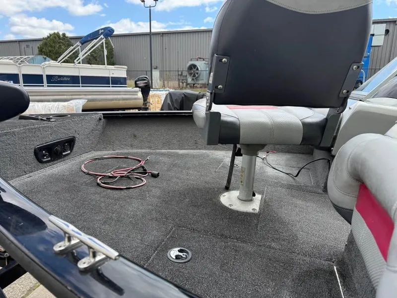 Slide: The Image of 2014 Tracker Pro Guide V-175 WT boat interior with seating and carpeted deck. - 10