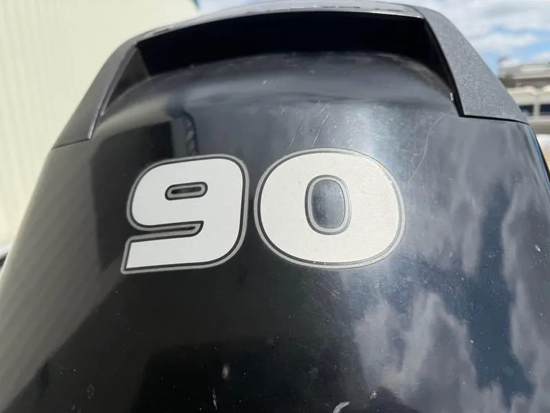 Slide: The Image of Close-up of a 90 HP outboard motor on a 2014 Tracker Pro Guide V-175 WT boat. - 11