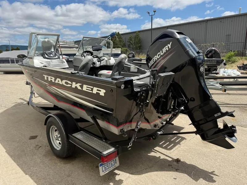 Slide: The Image of 2014 Tracker Pro Guide V-175 WT boat with Mercury engine on trailer. - 3