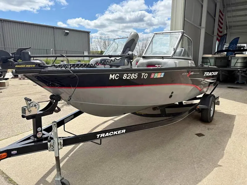 Slide: The Image of 2014 Tracker Pro Guide V-175 WT boat on trailer, parked outdoors. - 4