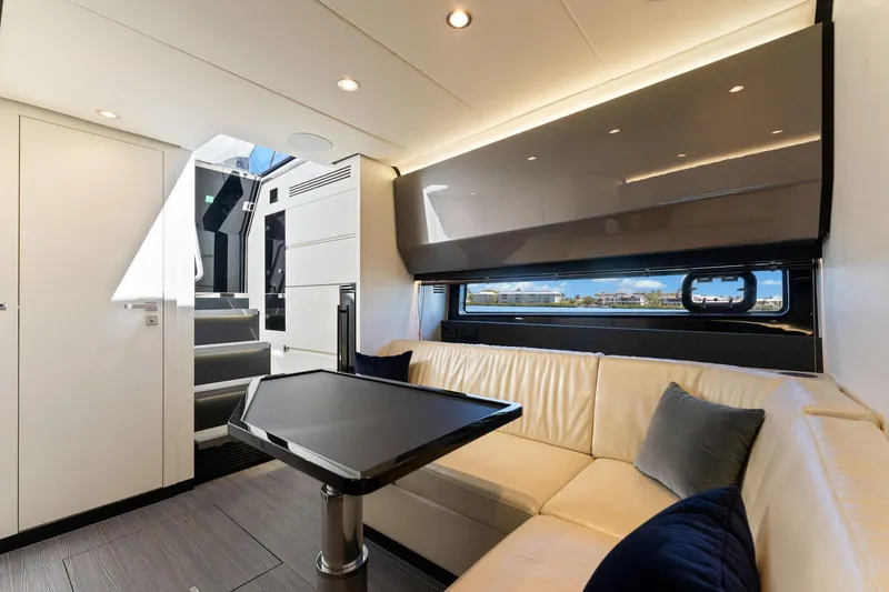 Slide: The Image of Luxurious interior of 2022 Azimut Verve 47 yacht with modern seating and table. - 12