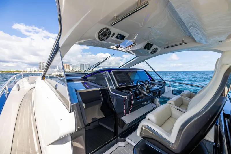 Slide: The Image of Luxurious 2022 Azimut Verve 47 yacht cockpit with modern controls, cruising on open water. - 5