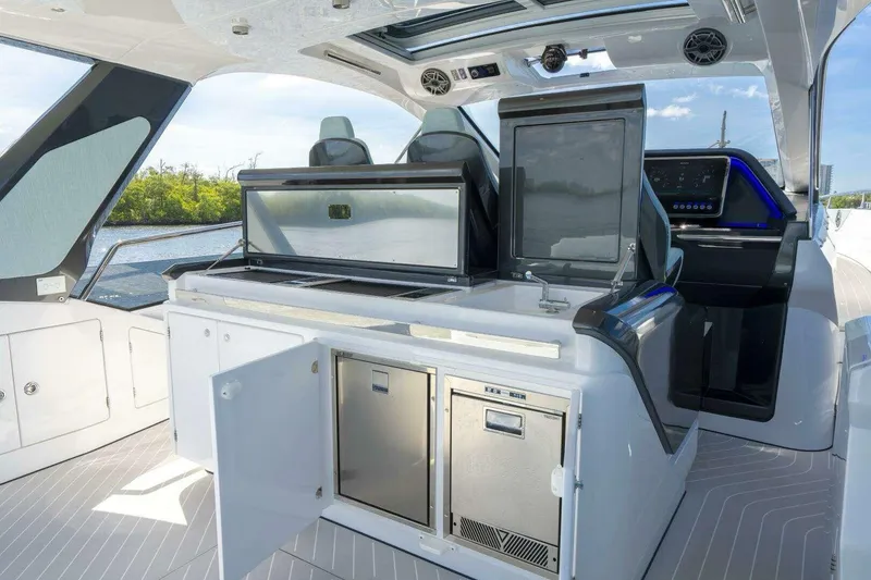 Slide: The Image of 2022 Azimut Verve 47 yacht interior with modern kitchen and navigation controls. - 8