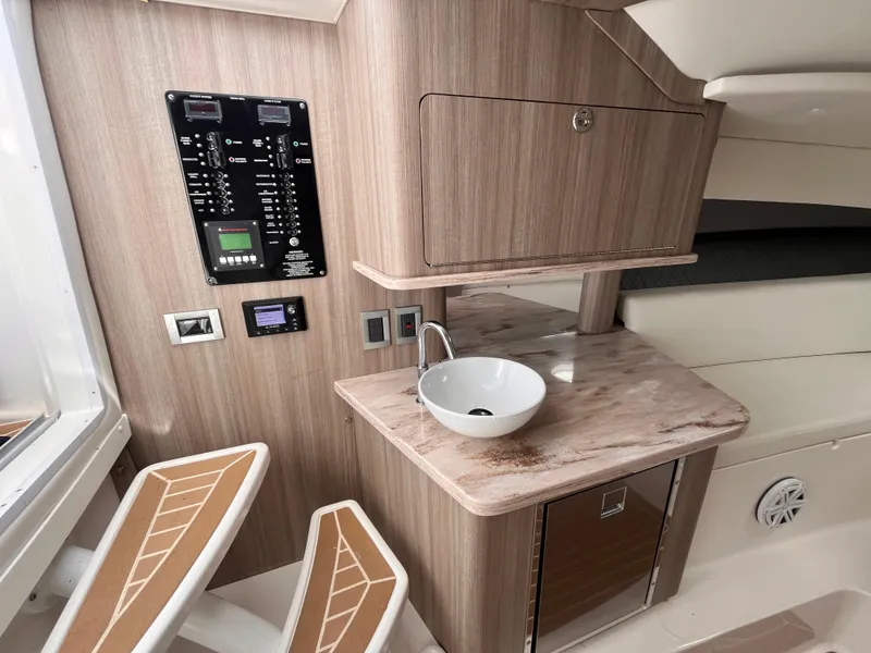 Slide: The Image of 2021 Fountain 38 SFC interior with modern sink and control panel. - 35