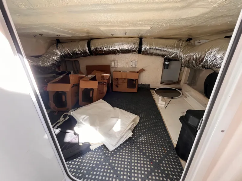 Slide: The Image of Storage area inside 2021 Fountain 38 SFC boat with boxes and ductwork. - 40