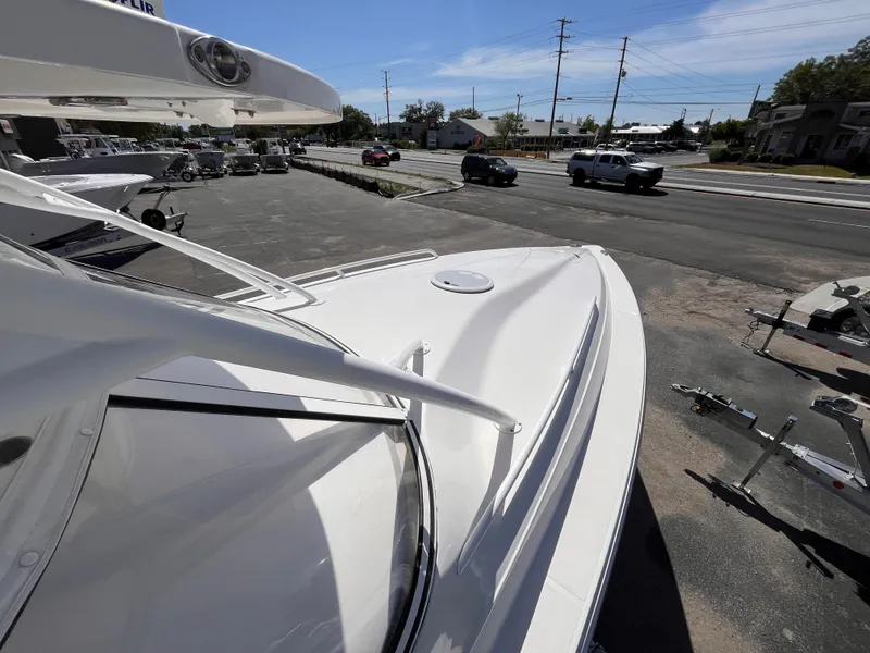 Slide: The Image of 2021 Fountain 38 SFC boat on display in a parking lot under clear skies. - 42