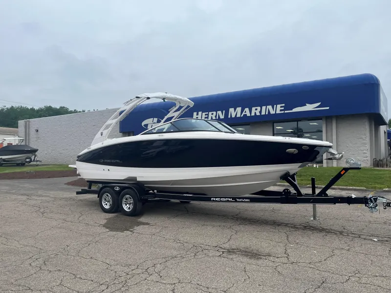 The Image of 2025 Regal LS6 boat on trailer outside Hern Marine dealership. - 0