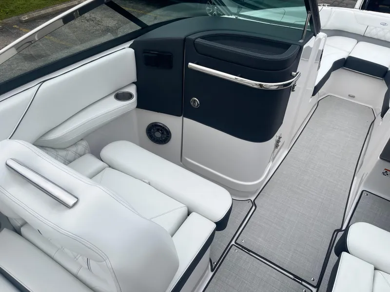 Slide: The Image of 2025 Regal LS6 boat interior with white seating and sleek design. - 11