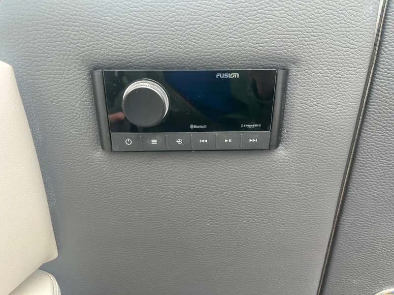 Slide: The Image of Control panel on Regal LS6 2025 boat, featuring Fusion audio system. - 16