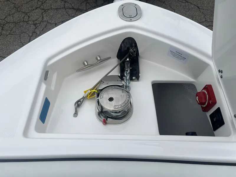Slide: The Image of 2025 Regal LS6 boat anchor compartment with winch and control panel. - 19
