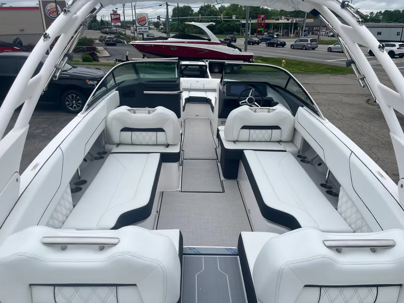 Slide: The Image of 2025 Regal LS6 boat interior with white seating and modern design. - 2