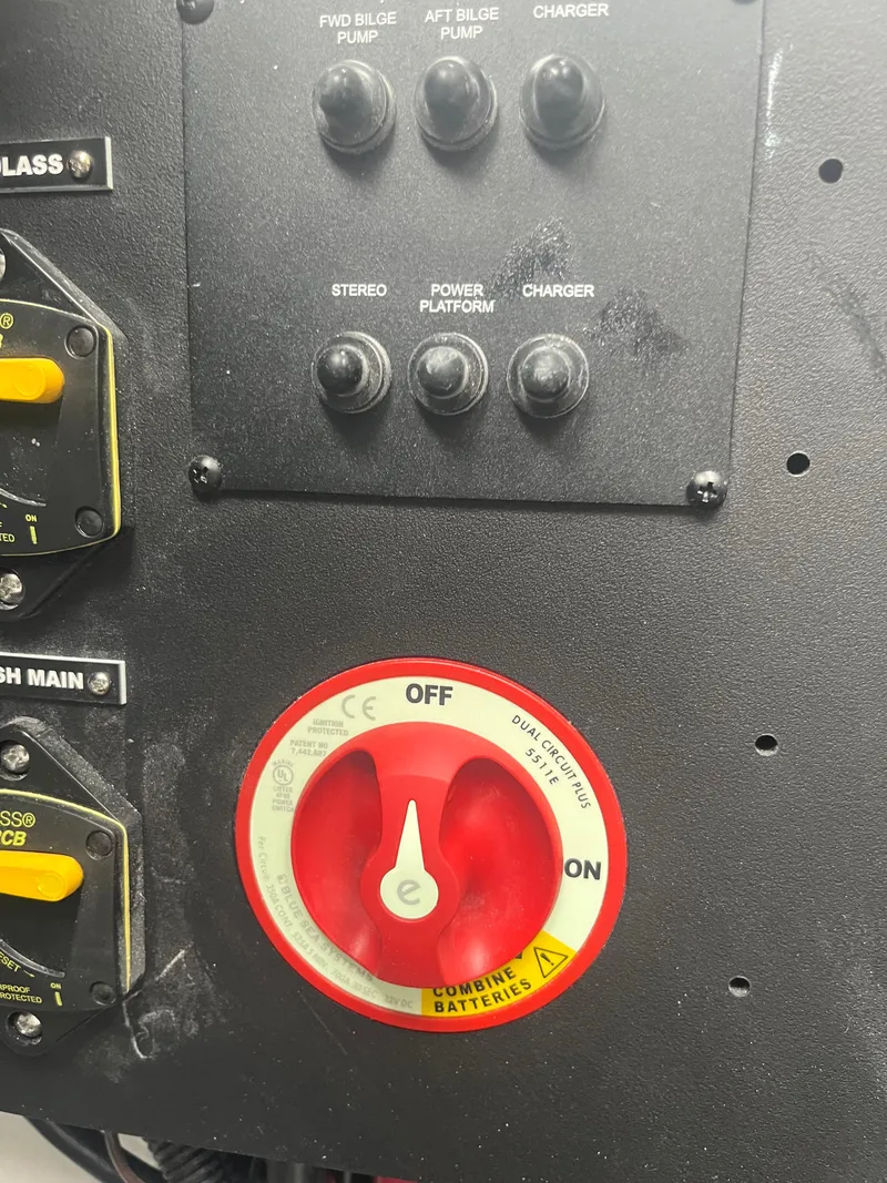 Slide: The Image of Control panel of a 2025 Regal LS6 boat with switches and battery dial. - 20