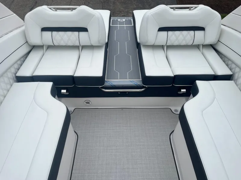 Slide: The Image of Luxurious 2025 Regal LS6 boat interior with plush white seating and modern design. - 6