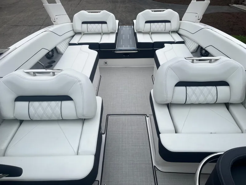 Slide: The Image of Luxurious 2025 Regal LS6 boat interior with white leather seating and modern design. - 7