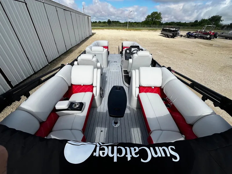 Slide: The Image of 2025 SunCatcher Elite 324 RC pontoon boat with spacious seating and modern design. - 11