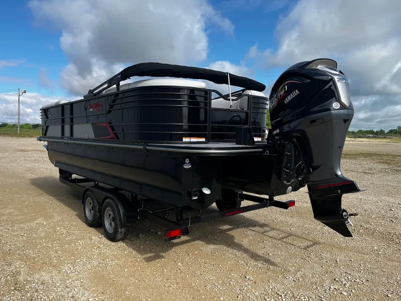 Slide: The Image of 2025 SunCatcher Elite 324 RC pontoon boat with Yamaha outboard motor on a trailer. - 5