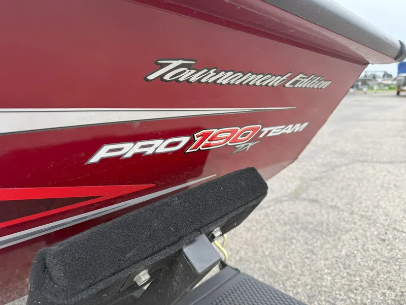 Slide: The Image of 2022 Tracker Pro Team 190 TX Tournament Edition boat, red exterior detail. - 16