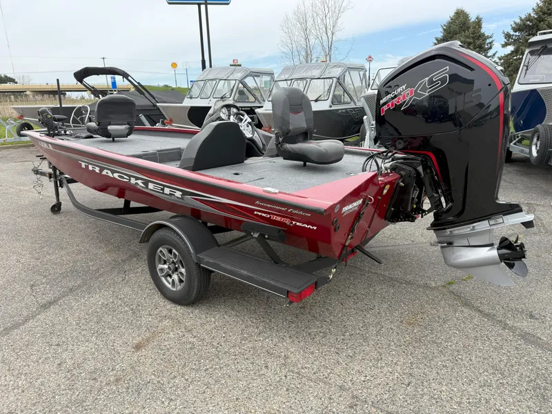 Slide: The Image of 2022 Tracker Pro Team 190 TX boat with Mercury engine, parked on a trailer. - 5