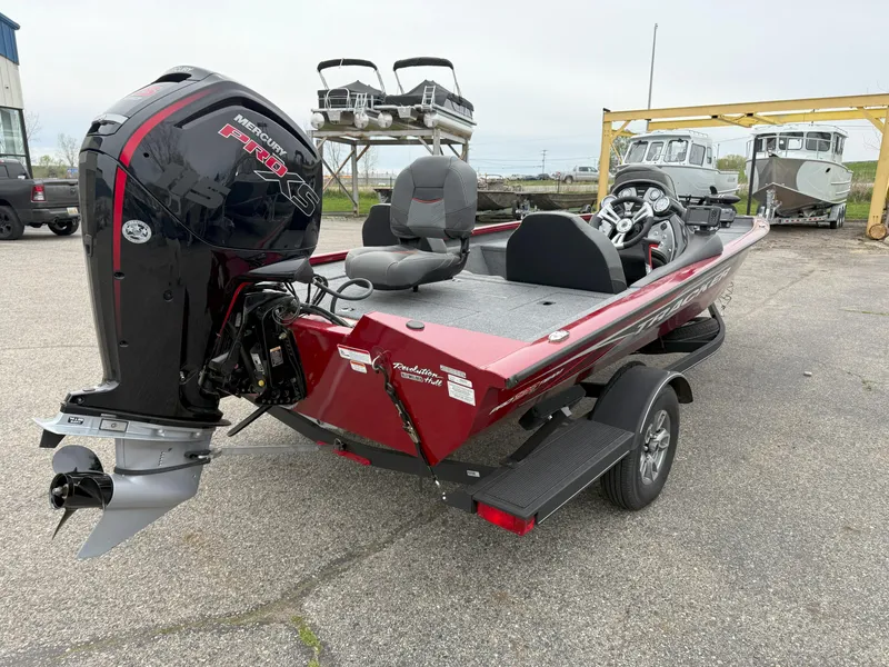 Slide: The Image of 2022 Tracker Pro Team 190 TX boat with Mercury engine, parked on a trailer. - 6