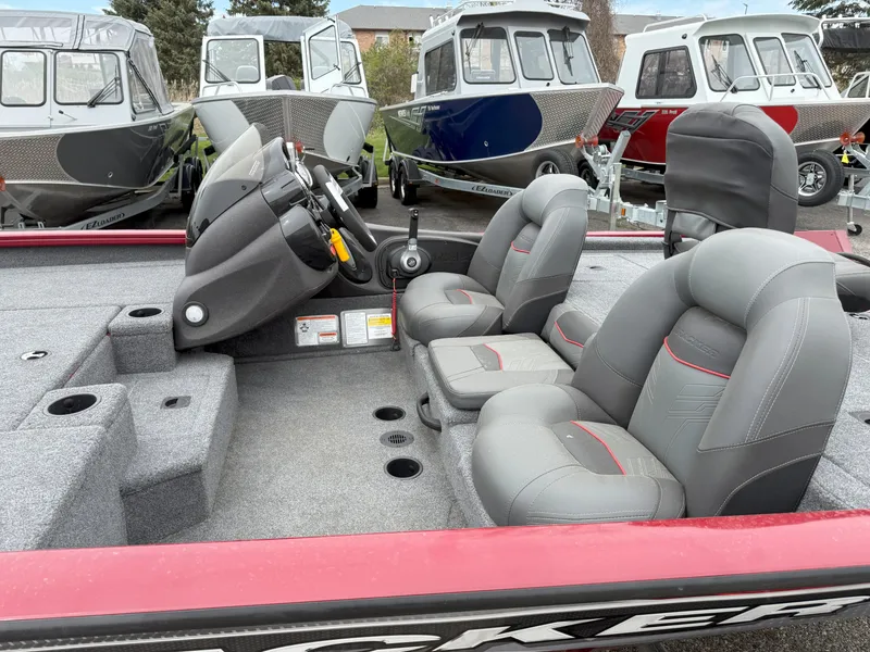 Slide: The Image of 2022 Tracker Pro Team 190 TX boat interior with gray seats and steering console. - 8