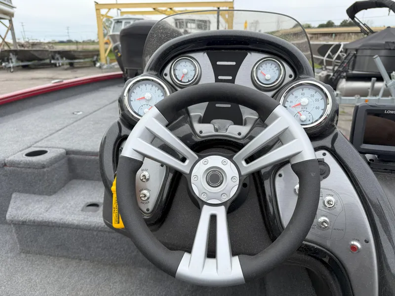 Slide: The Image of Steering wheel and dashboard of 2022 Tracker Pro Team 190 TX boat. - 9
