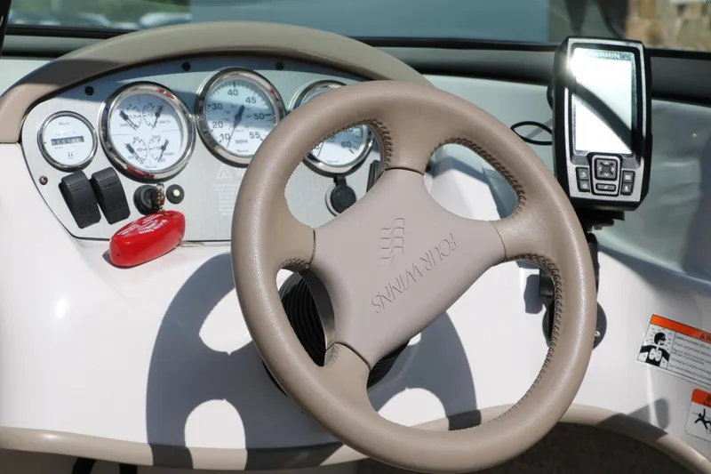 Slide: The Image of Steering wheel and dashboard of 2006 Four Winns 180 Horizon boat. - 15