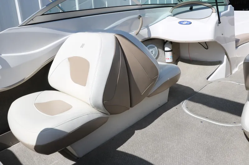 Slide: The Image of 2006 Four Winns 180 Horizon boat interior with beige and white seating. - 17