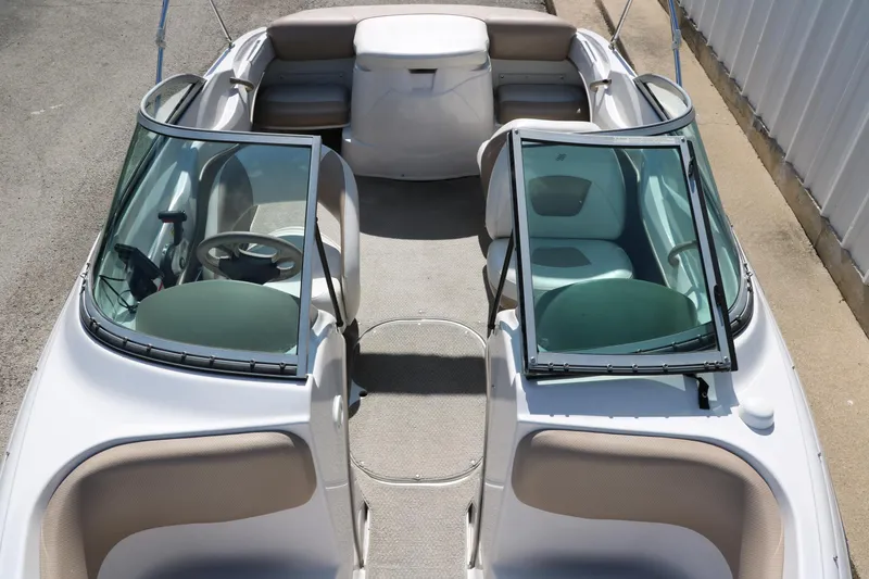 Slide: The Image of 2006 Four Winns 180 Horizon boat interior with open windshield and seating. - 19