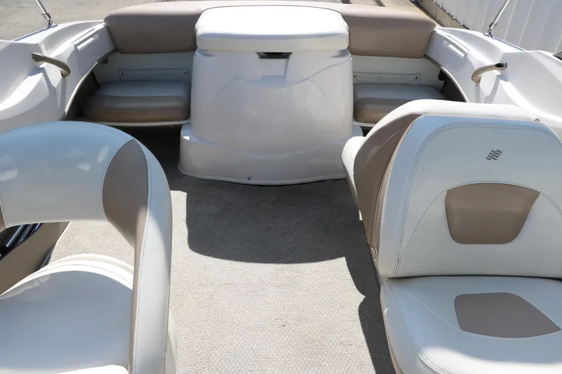 Slide: The Image of 2006 Four Winns 180 Horizon boat interior with beige and white seating. - 21
