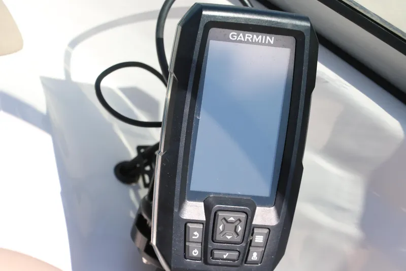 Slide: The Image of Garmin GPS device on 2006 Four Winns 180 Horizon boat dashboard. - 23